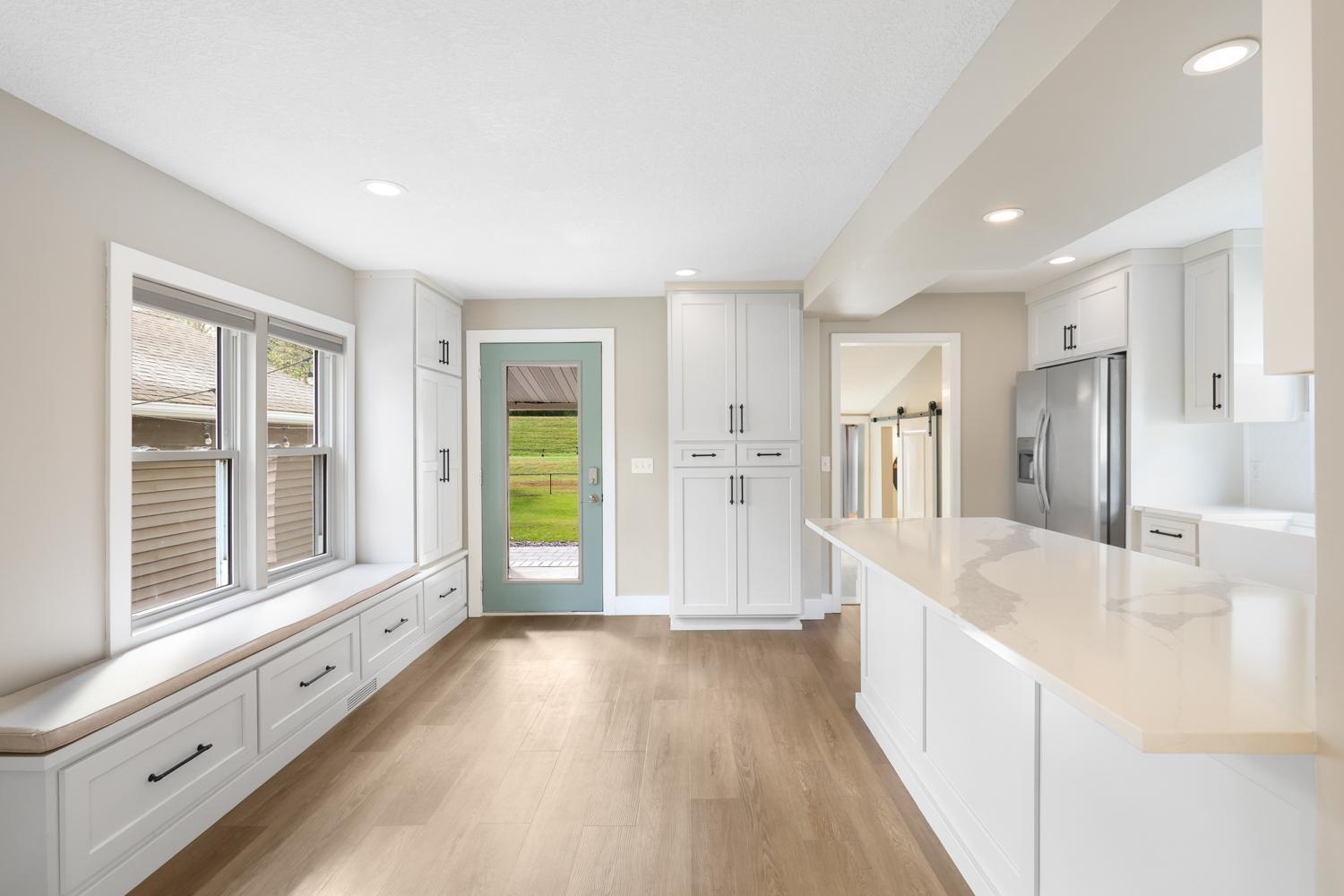 The completely remodeled kitchen and informal dining area is this home's centerpiece attraction.