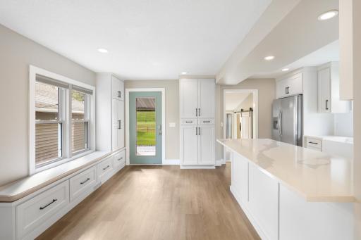 The completely remodeled kitchen and informal dining area is this home's centerpiece attraction.