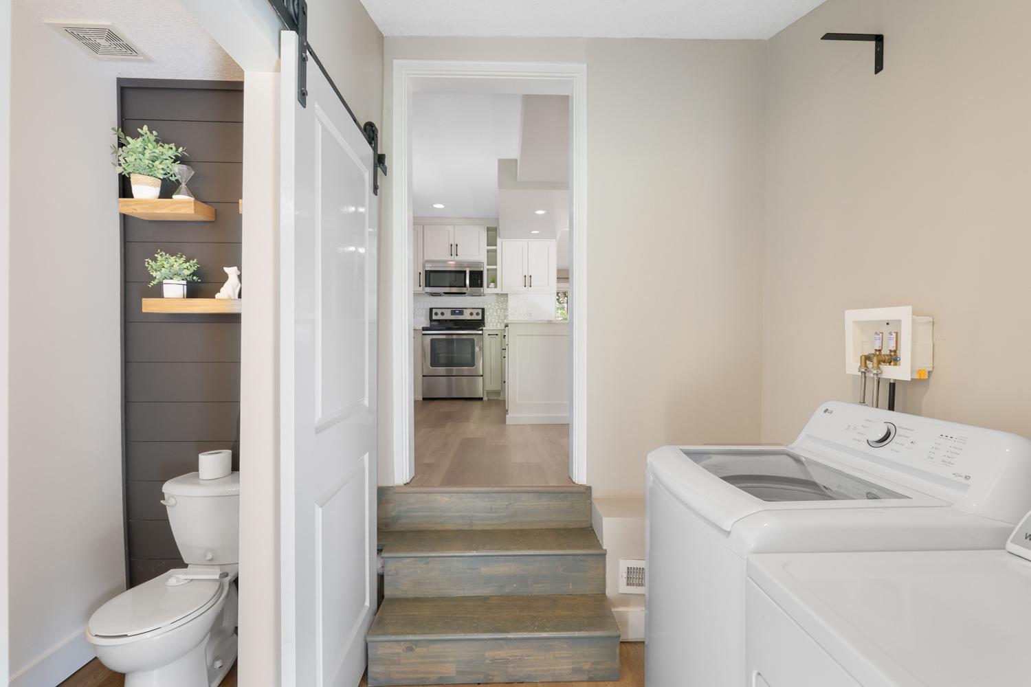 The laindry room is conveniently located just off the kitchen.