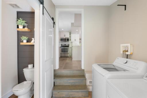 The laindry room is conveniently located just off the kitchen.