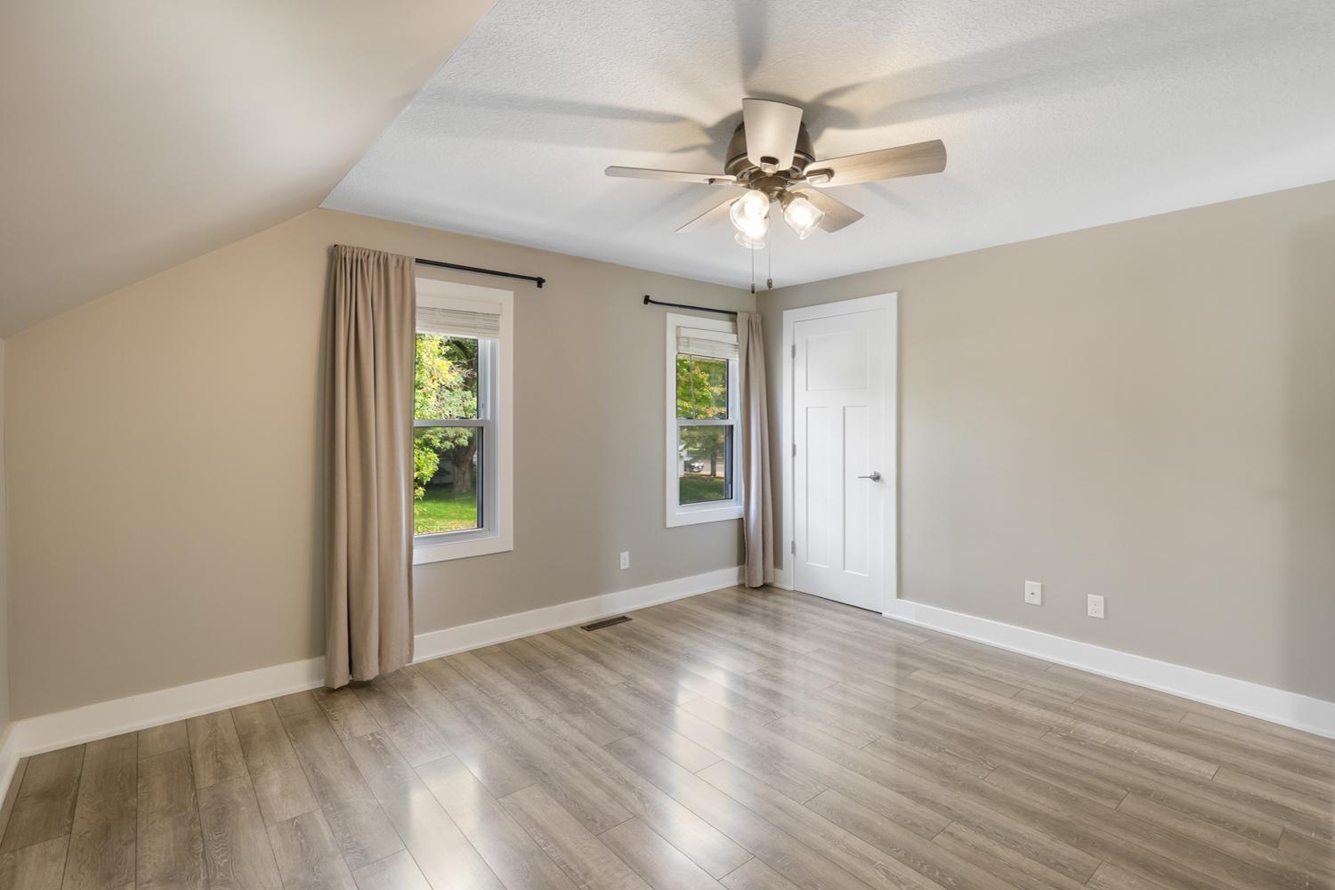 The primary bedroom has a walk-in closet and 2 windows.