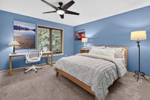 Upper level roomy bedroom with generous walk-in closet and area for desk.