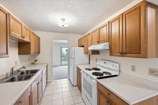 Counter space on both sides of the sink and stove.