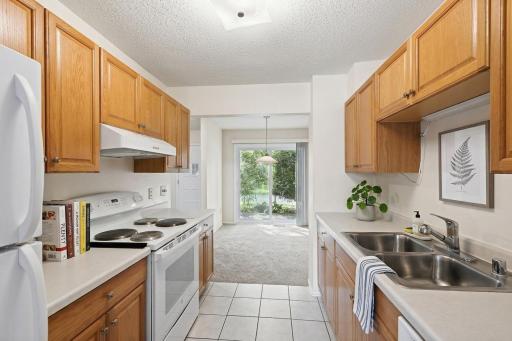 Lots of lovely cabinetry and counter space in the kitchen. (virtually staged)