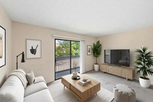 Very spacious living room, with access to the charming outdoor balcony. (virtually staged)