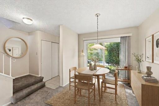 Nice entry way with lots of closet space, and the dining area is flooded with natural light. (virtually staged)