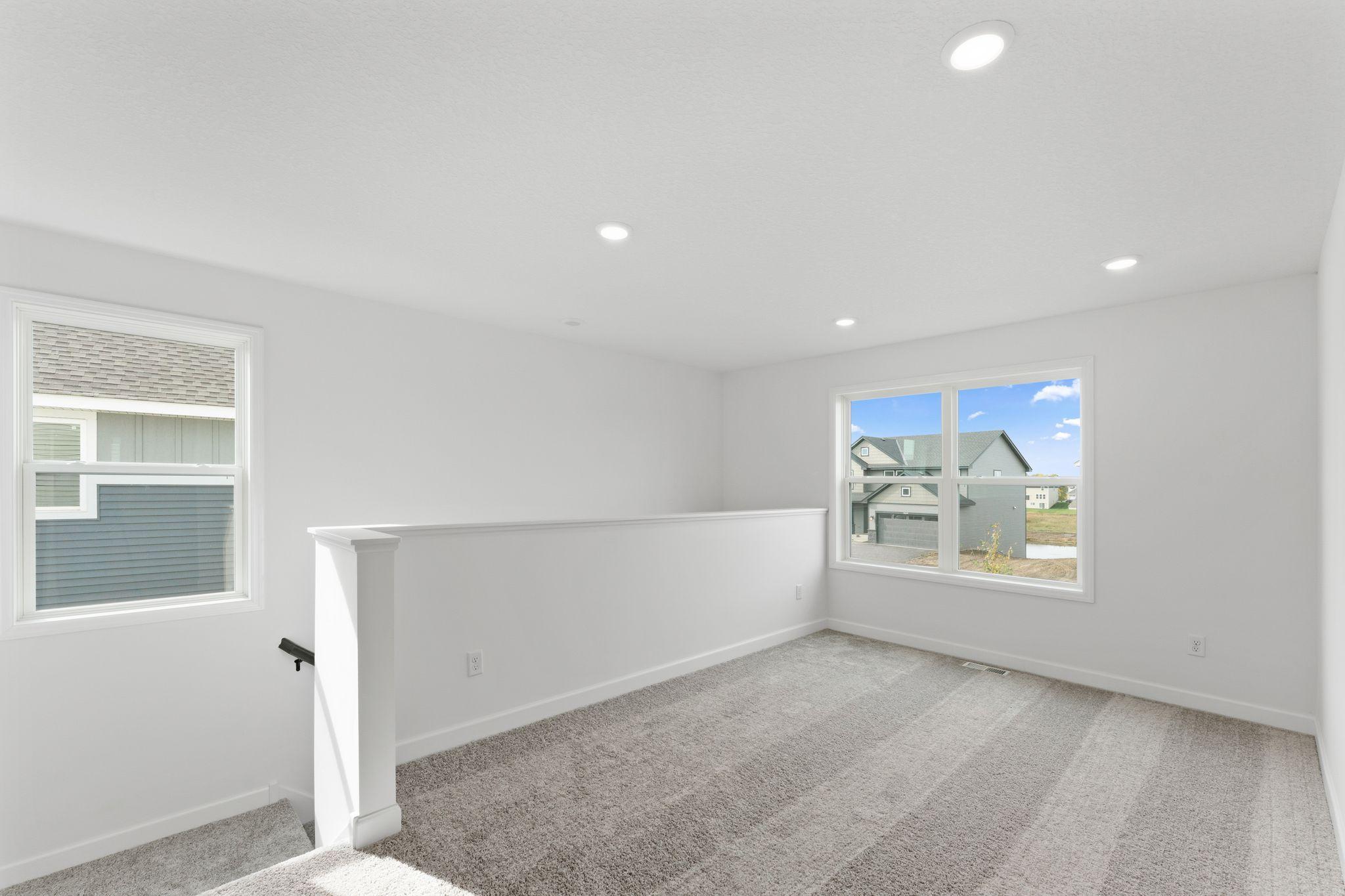 The versatile loft area can be found at the top of the stairs and is adaptable to the unique needs of any homeowner.
