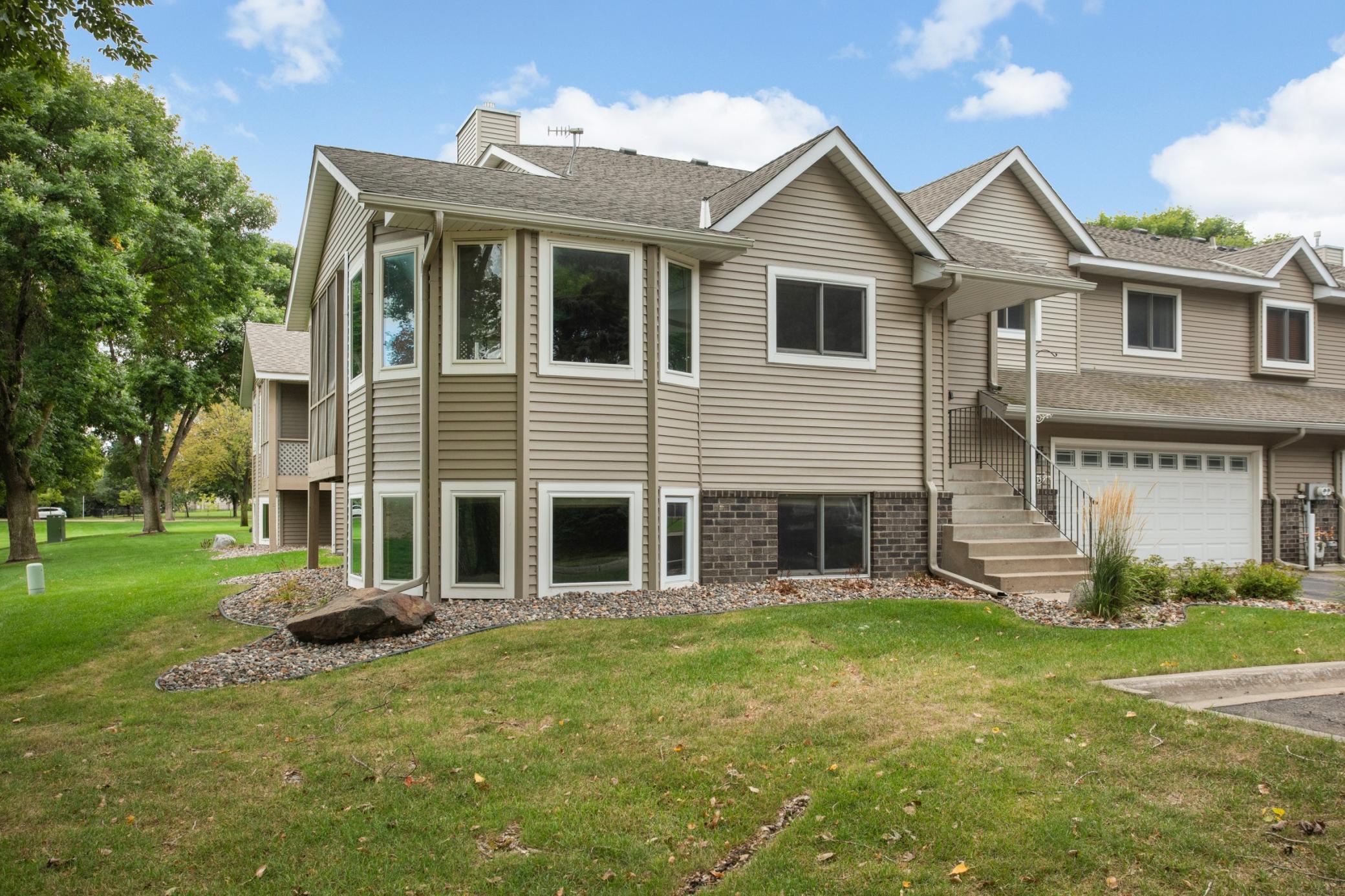 Rare end-unit with wooded tree line for more privacy
