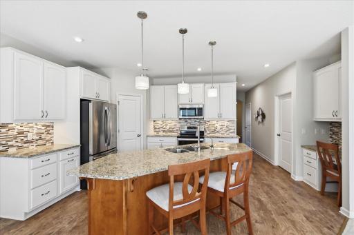 Welcome to 8773 Irving Blvd N! Enjoy a beautifully designed kitchen with a generous center island and seamless flow into the main living areas!