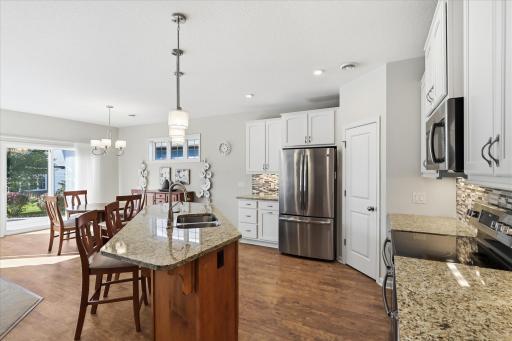 Spacious kitchen featuring an oversized center island, perfect for meal preparation, casual dining, and entertaining!