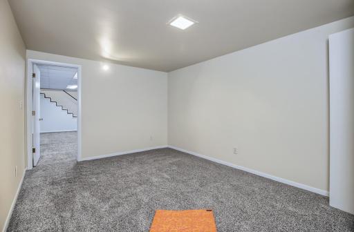 Lower level bedroom with new carpet 2026.