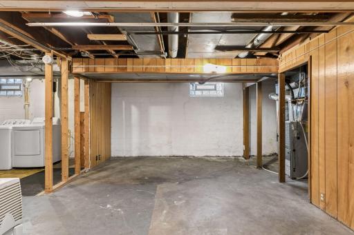 Lower Level Unfinished space - Ample room for storage & more!