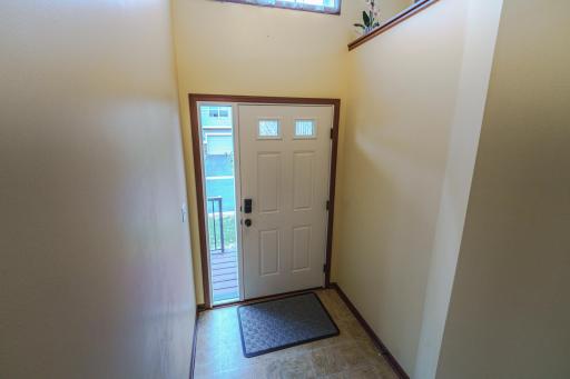 The entry foyer has a full-view sidelight window.