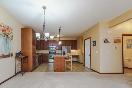The generous kitchen offers abundant cabinetry, a center island, a pantry, and stainless appliances.