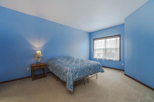 The primary bedroom faces south and has a window alcove.