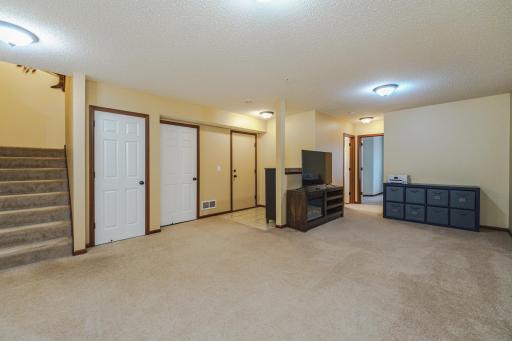There is under-stair storage in the door on the left, as well as mechanical room and garage access.