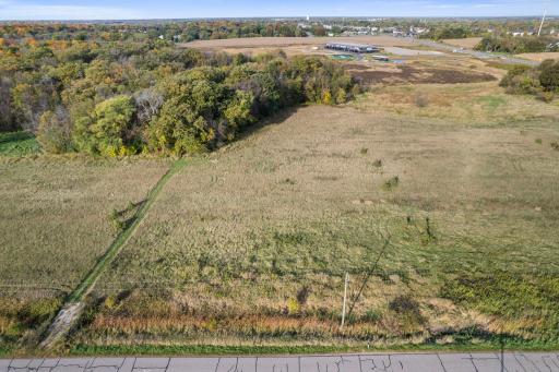 Recommended build site is in front of the pocket of trees.
