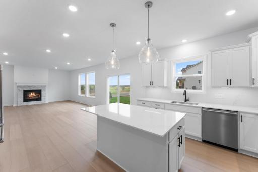The kitchen has ease-of-access to the mudroom and flows seamlessly into the dining room