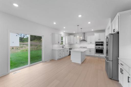 The open floorplan provides ample light and flow to this stylish home