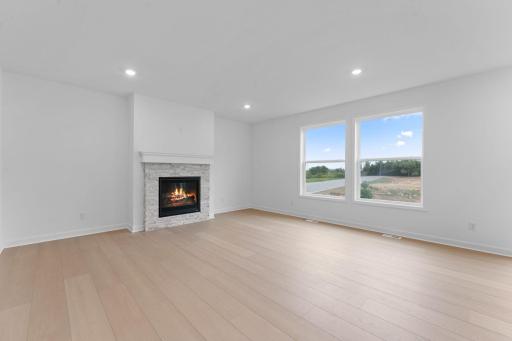 The Great Room features large windows for ample natural light and is the perfect place for gathering with friends and family.