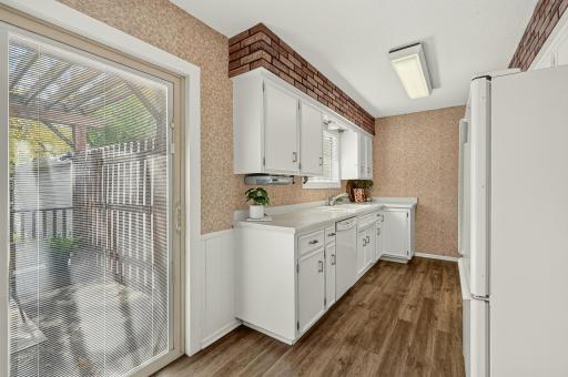 Newer LVP flooring with easy access to the deck, perfect for extending your living outdoors.