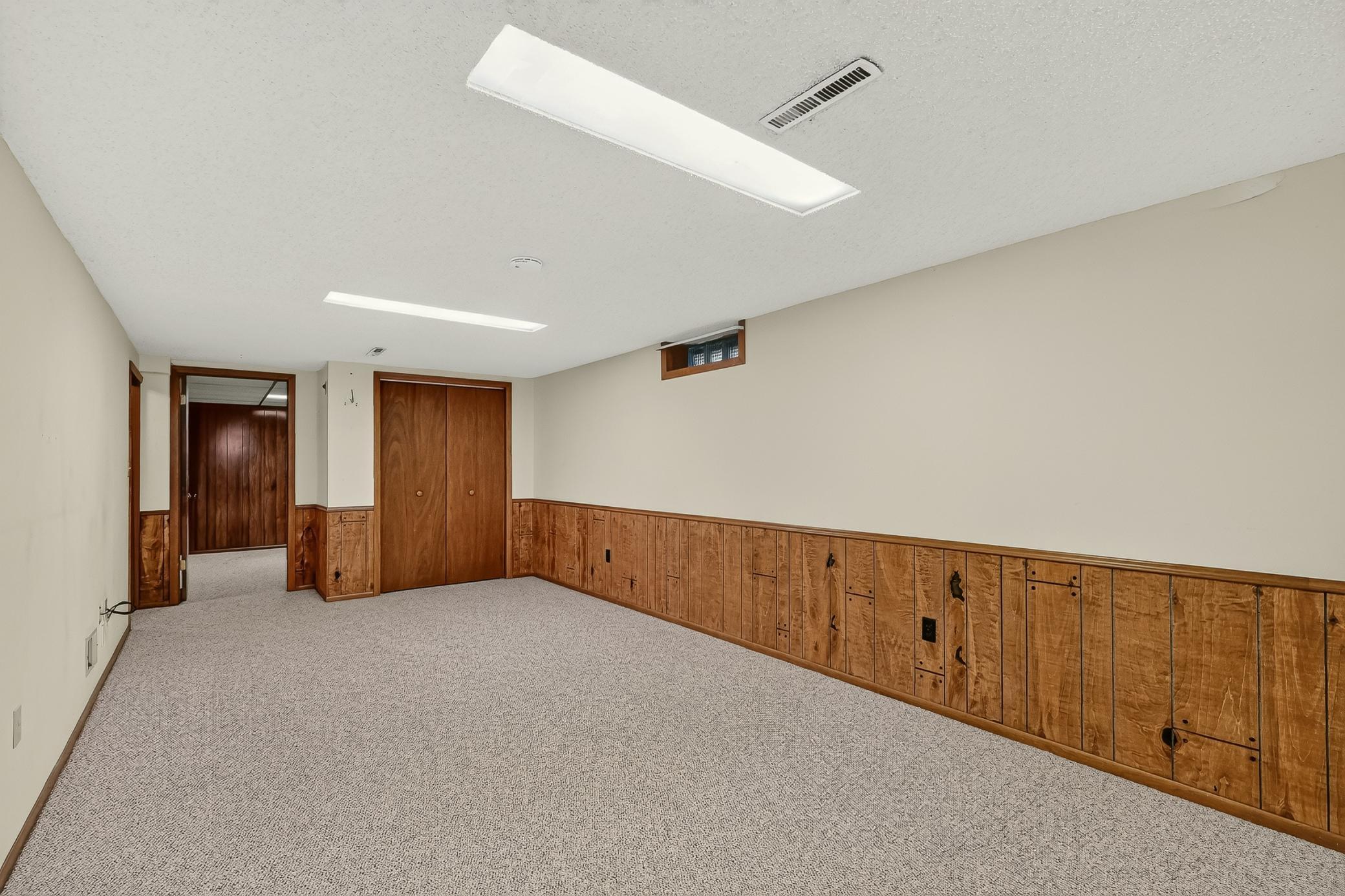 Family room with nice storage closet.