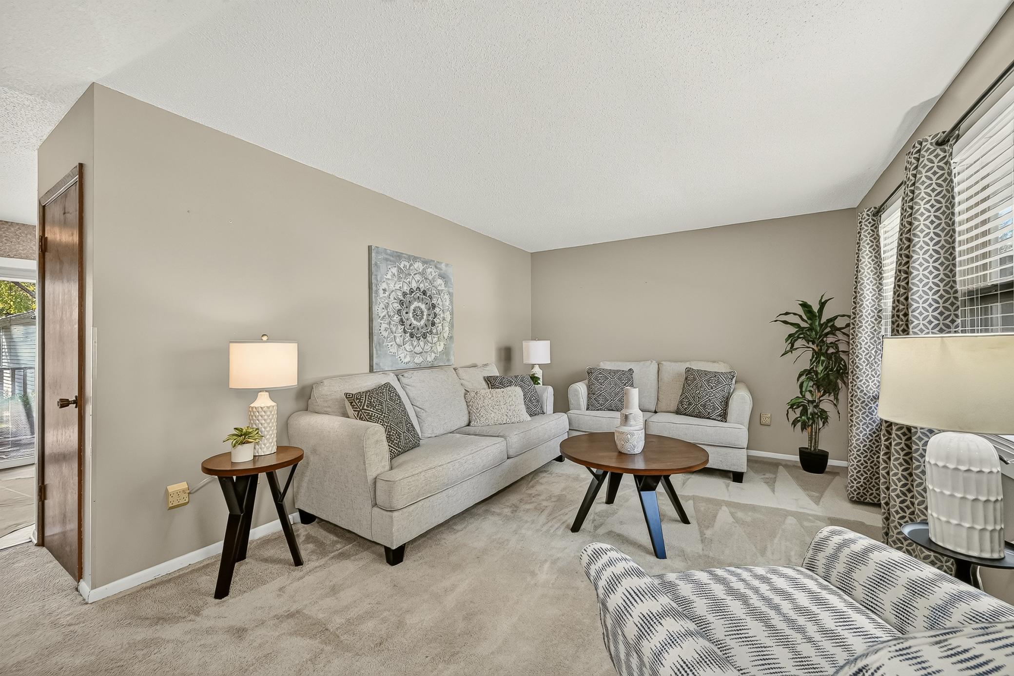 Newer carpeting with plush padding adds an extra layer of comfort underfoot.