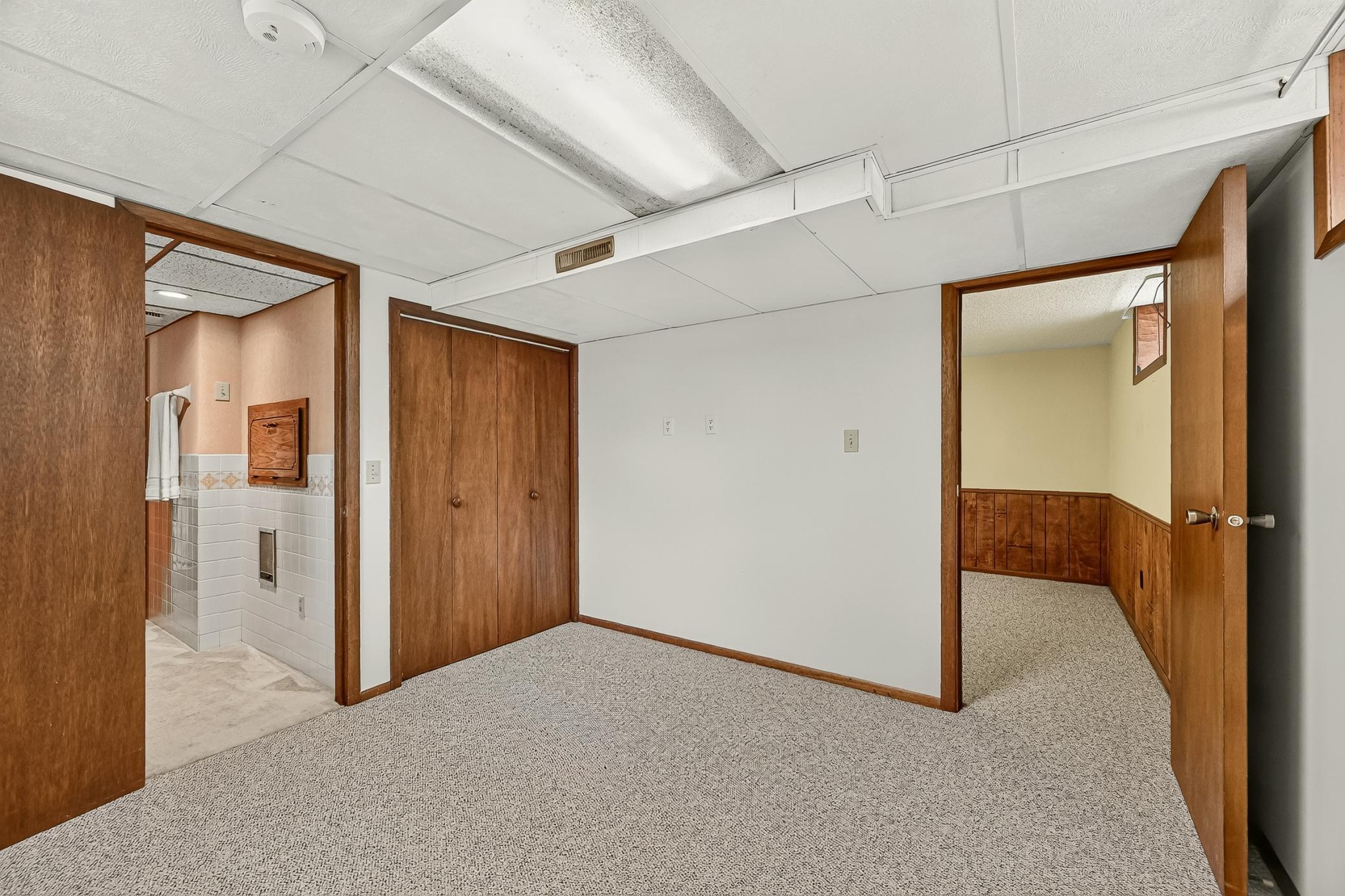 Tucked privately at the back of the family room, this versatile bonus room offers direct access to the bathroom and plenty of possibilities for use.