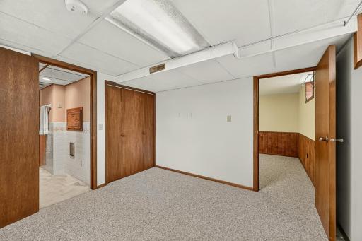 Tucked privately at the back of the family room, this versatile bonus room offers direct access to the bathroom and plenty of possibilities for use.