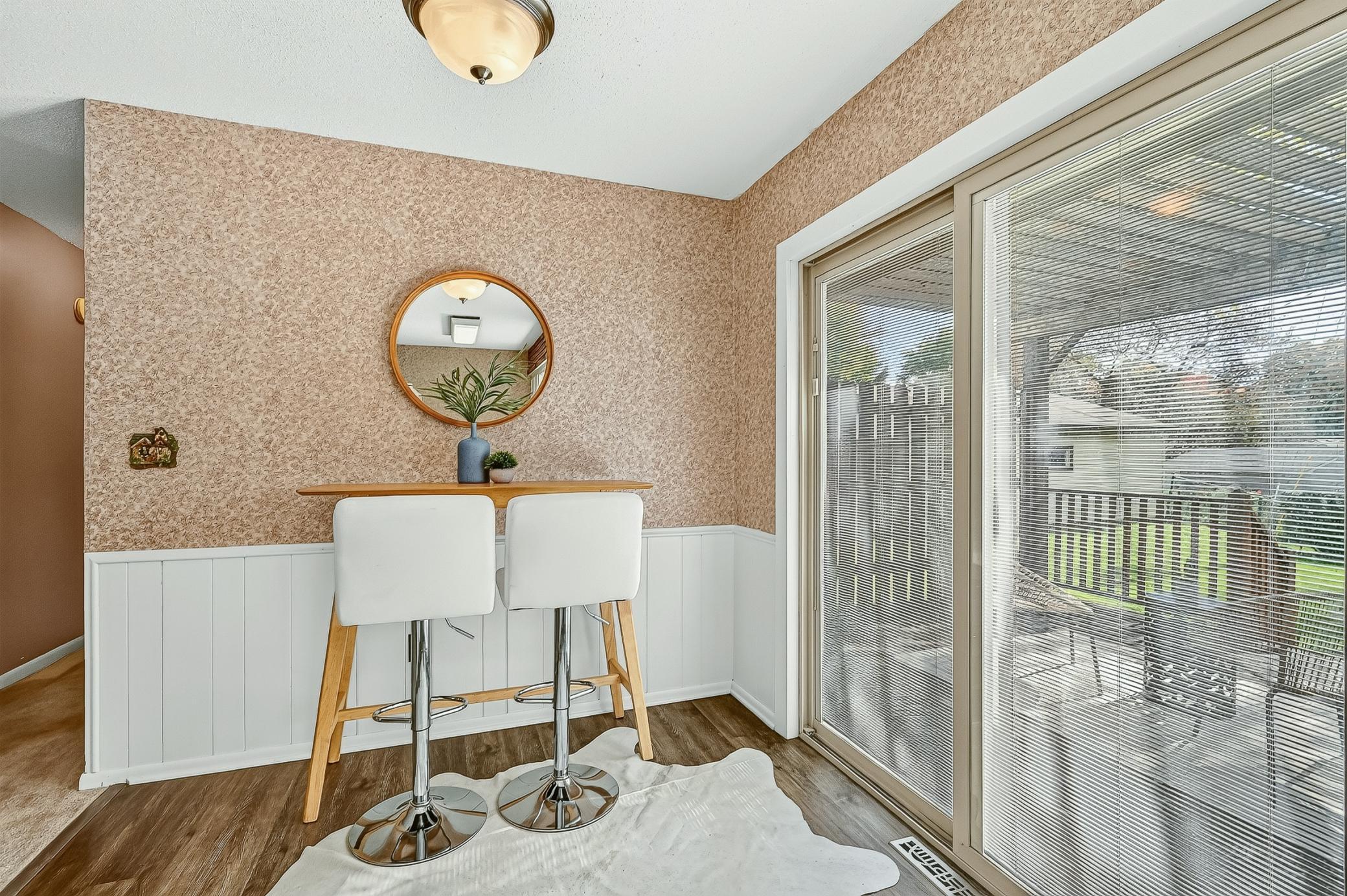 Bright and sunny eat-in kitchen offers plenty of flexibility, with room for a larger table and additional seating, or space for a stylish coffee bar, buffet/hutch or additional storage.