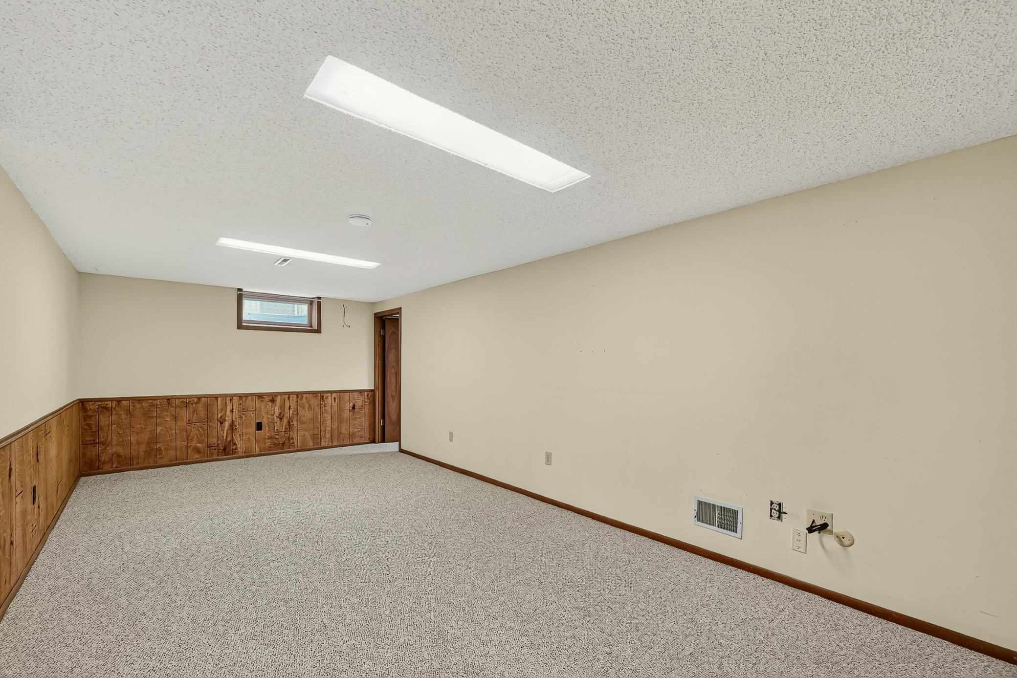 Very spacious lower level family room.