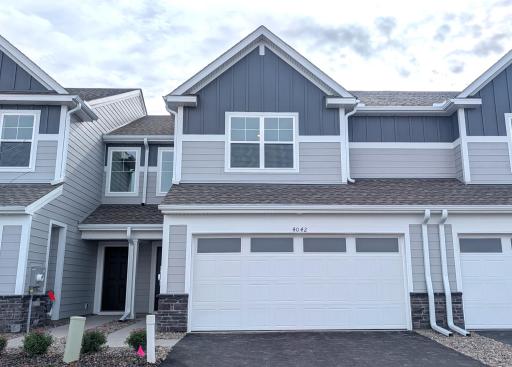 Welcome to 4042 Hayward Ave N! (Photo is of the actual home.)