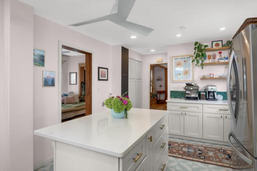 Enjoy counter seating, a charming coffee nook, and don't miss the functional pantry storage.
