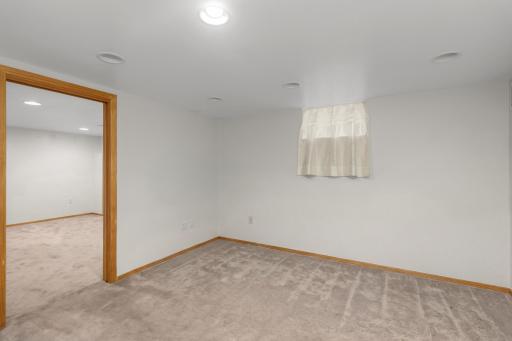 The lower level is partially finished and features a relaxing TV room/den.
