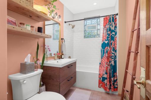 The bathroom has been completely remodeled and looks like it's straight out of a designer magazine! It also features stunning Zellige floor tile.