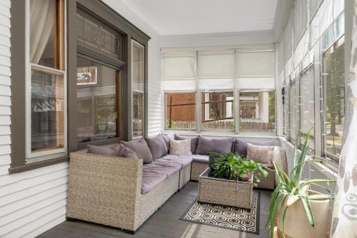 The front three-season porch is the perfect spot for happy hour and morning coffee.