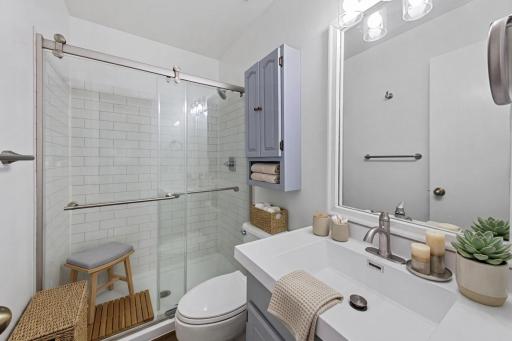 Virtually staged 3/4 remodeled primary bath.