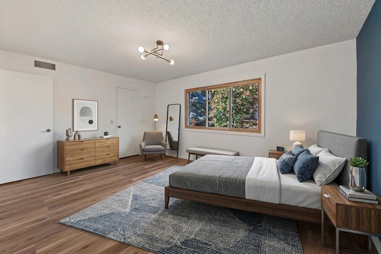 Virtually staged primary bedroom with 7X5 walk in closet and 3/4 bath.
