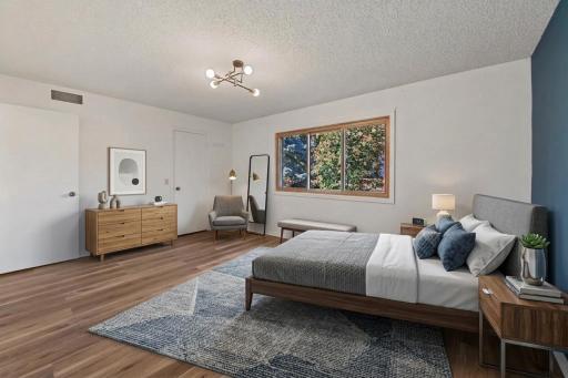 Virtually staged primary bedroom with 7X5 walk in closet and 3/4 bath.