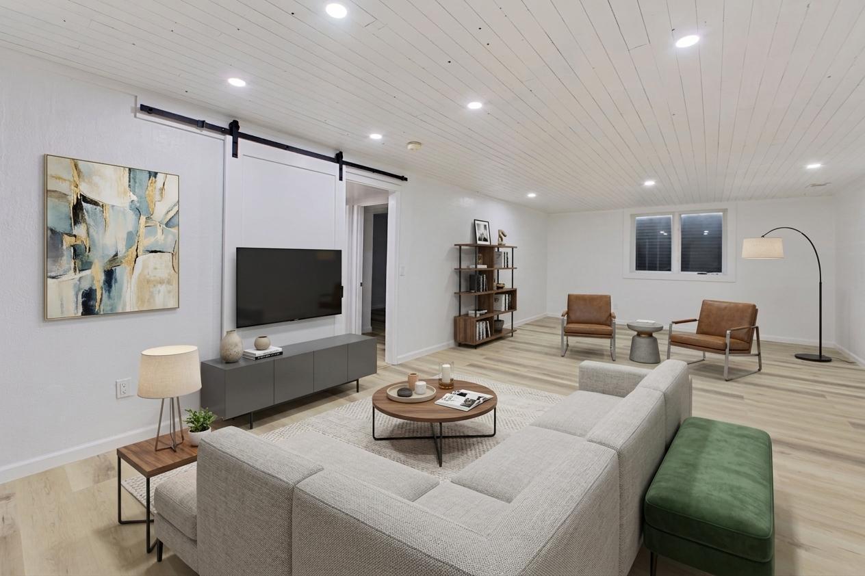 Virtually staged family room with egress windows for lots of natural light.