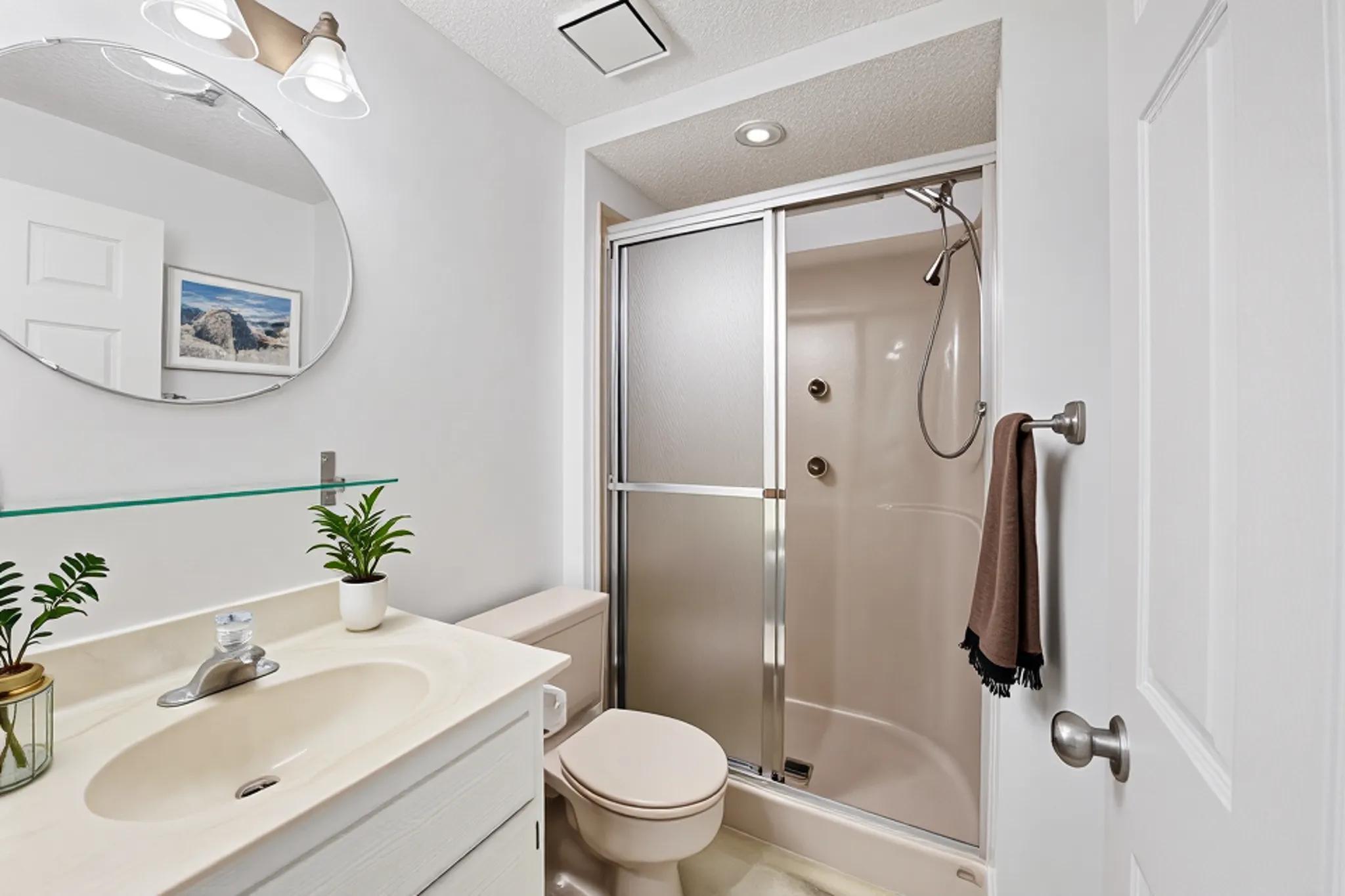 Virtually staged 3/4 remodeled bath.