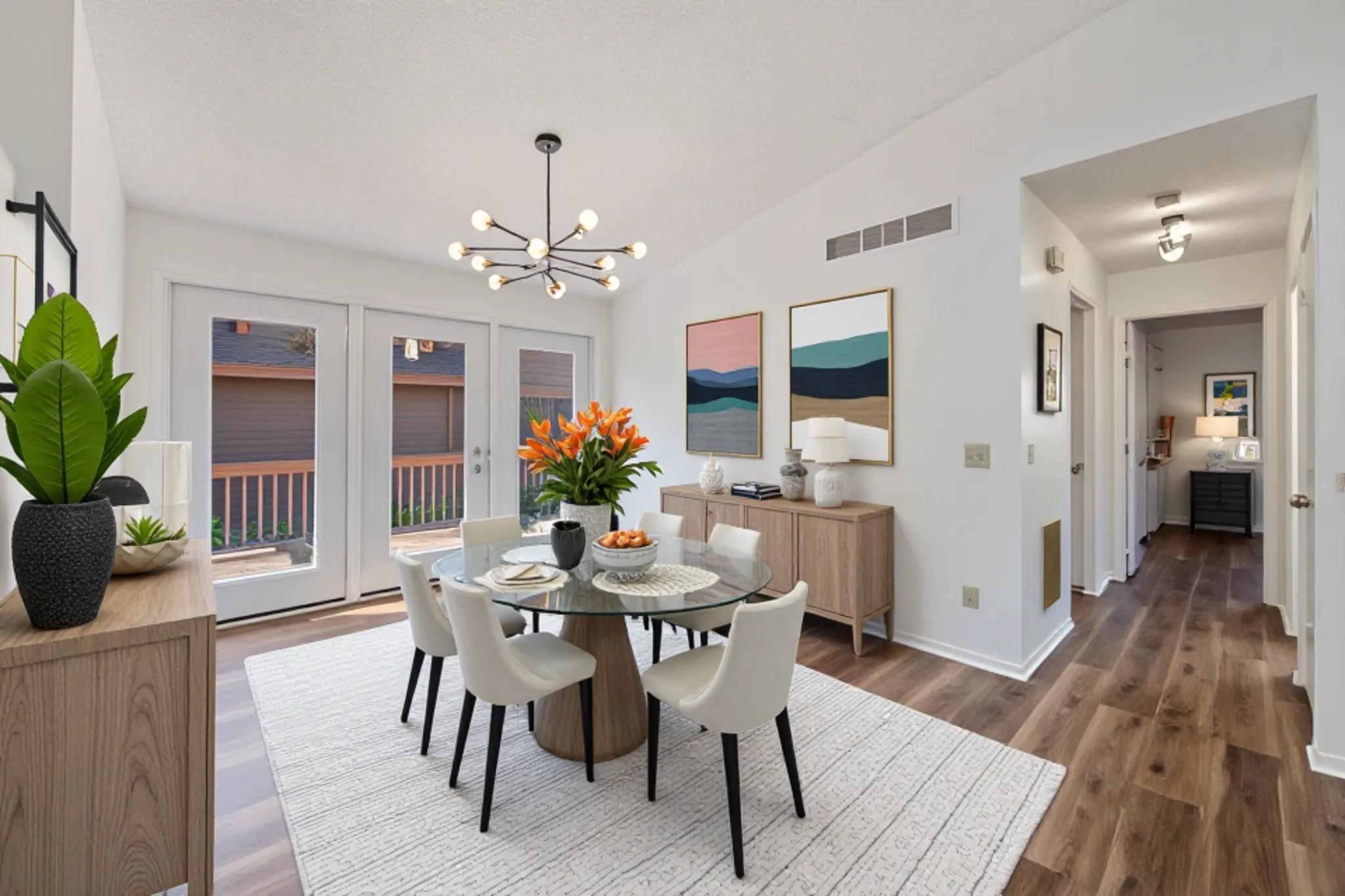 Virtually staged vaulted dining room.