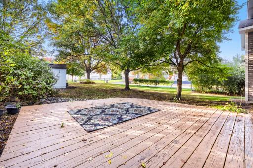Enjoy outdoor living on this spacious backyard deck, perfect for grilling, entertaining, or simply relaxing with your morning coffee! This inviting space offers a peaceful setting with plenty of room for patio furniture & gatherings with family