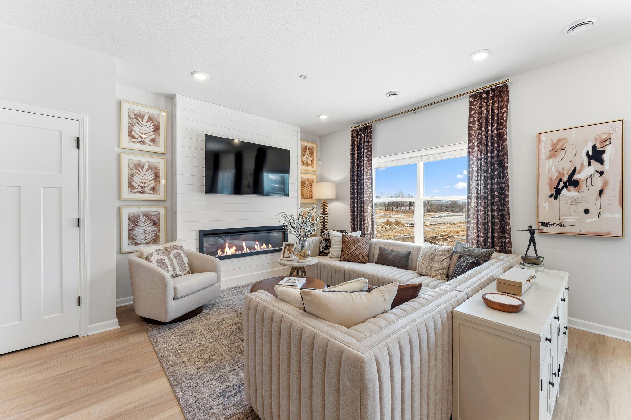 Kick back and relax in this inviting living room, seamlessly connected to the kitchen for easy everyday life. *Photo of a previously built home of the same floor plan. Finishes/options may vary.