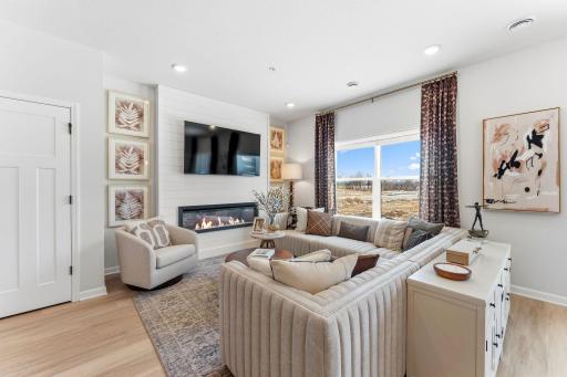 Kick back and relax in this inviting living room, seamlessly connected to the kitchen for easy everyday life. *Photo of a previously built home of the same floor plan. Finishes/options may vary.