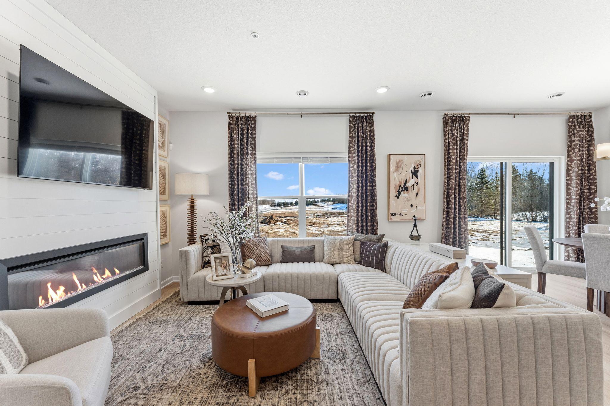 Soak up the sunshine in this bright living room, complete with large windows and plenty of room to relax. *Photo of a previously built home of the same floor plan. Finishes/options may vary.