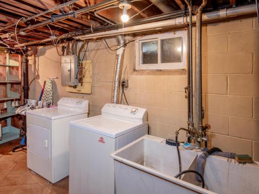 Spacious Laundry Room with lots of Storge spaces.