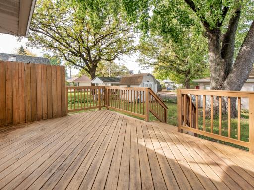 Awesome Deck with Partial Privacy Fence and two separate set of stairs.