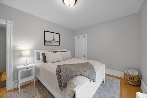 Bedroom three offers a comfortable retreat with hardwood floors and ample closet space.