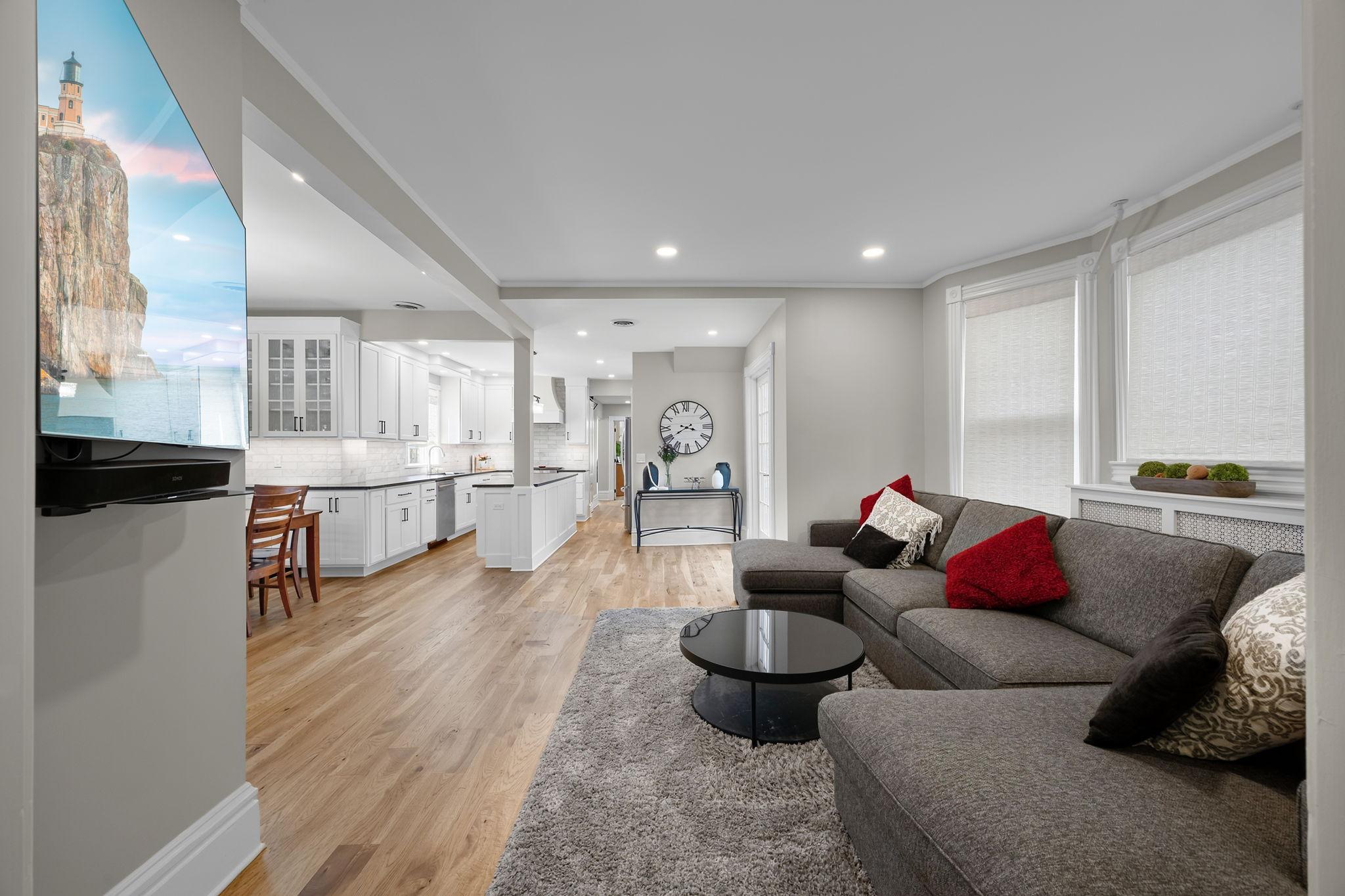 A different perspective of the living room highlighting the bright, open-concept main level.